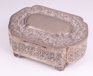 An embossed Continental silver trinket box of shaped form with hinged lid and lining, on pierced panelled supports, base marked 900 QA, 7cm x 21cm x 15cm, 727 grams gross weight