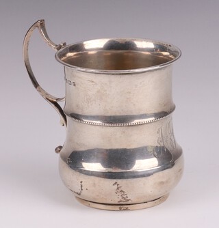 An Edwardian silver christening tankard with bead work decoration Birmingham 1904, by Charles S Green Company Ltd., marks rubbed, 8cm, 77 grams 