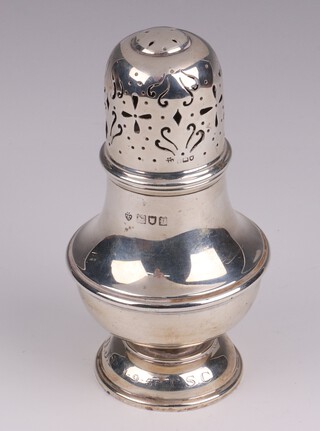 An Edwardian Georgian style silver sugar caster of baluster form, London 1910, makers marks rubbed, base inscribed, 11cm, 88 grams 