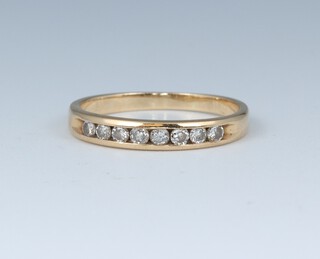 A yellow gold marked 14k half eternity ring set 8 diamonds, size L, 1.78 grams 