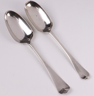 A George II silver bottom mark spoon, with shell back, engraved W*T S*M, London 1755, by Ebenezer Coker, a George I ditto, engraved EM, London 1725 by Hugh Arnett & Edward Pocock, 113 grams 