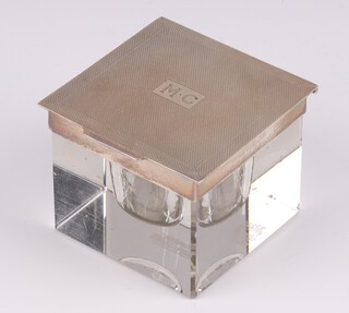 An Art Deco square cut glass and silver mounted inkwell, the engine turned hinged lid monogrammed M.C. with detachable glass inkwell Birmingham 1936 by Deakin & Francis 5.5cm h x 7cm 