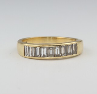 A 18ct yellow gold half eternity ring set 10 baguette cut diamonds, size O, 4.5 grams 
