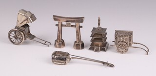 Five Japanese novelty Sterling condiments in the form of a rickshaw marked 950, a gateway marked 950, a pagoda, a stringed instrument and a hand cart all marked Sterling, 112 grams 