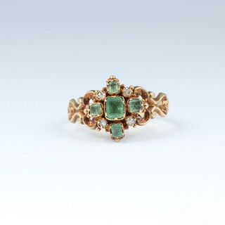 A yellow gold testing as 18ct ring set green and white stones, Size M , 2.8 grams 