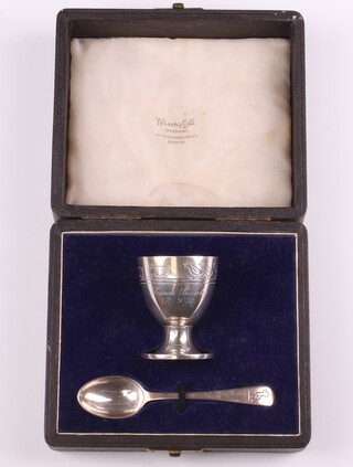 A cased silver christening set with egg cup and spoon, engraved with farmyard animals, London 1948 by Wakeley and Wheeler, 55 grams 