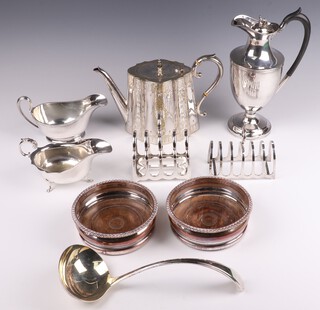 A pair of silver plated bottle coasters, 2 silver plated sauce boats, 2 toast racks and other plated items 