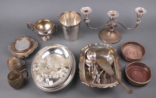 A circular silver plated ice pail with swing handle, silver plated teapot stand, entree dish and cover and other items of plated ware 
