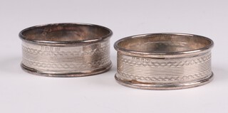A pair of engraved silver napkin rings Birmingham 1933 by Gomms, 17 grams