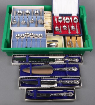 A silver handled pie slice Sheffield 1976, a silver handled cake knife and ditto bread knife Sheffield 1978, a silver handled cheese knife Sheffield 1981, all cased (4), together with a collection of silver plated flatware 