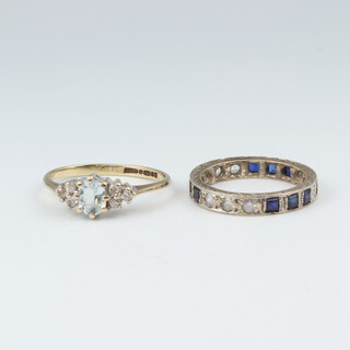 A 9ct white gold half eternity ring set square cut sapphires (1 missing) and white stones, size G, together with a 9ct gold dress ring set a blue stone with 6 white stones to the centre, 3.2 grams gross 