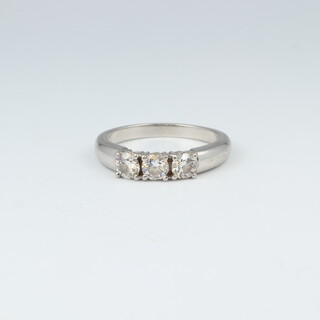 A platinum 3 stone diamond ring marked Plat., size O, 6.5 grams 