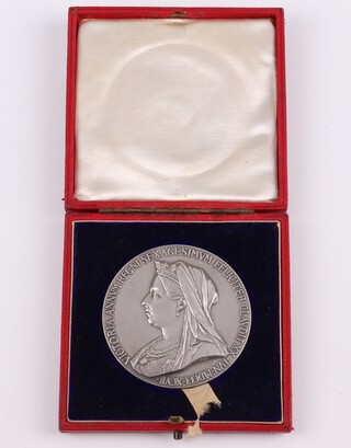 A silver medallion commemorating Queen Victoria's Diamond Jubilee of 60 years 1837-1897, contained in original fitted red Morocco case with gilt lettering 