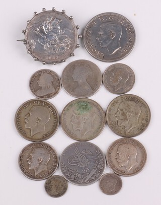 A collection of pre-1947 coinage to include a Victoria crown 1887 mounted as a brooch, a 1937 full crown, a small collection of shillings and florins and an Egyptian 10 qirsh, etc, total weight 163 grams 