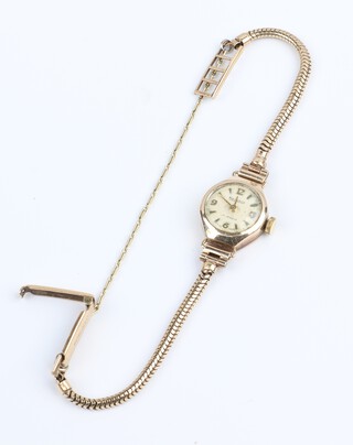 A lady's Regency wristwatch with white dial, Arabic numerals, the movement signed Sandoz, contained in a 9ct gold case with integral bracelet, gross weight 8.2 grams 
