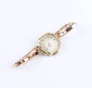 A lady's wristwatch with square white dial, Arabic numerals, the movement marked Swiss Made, 15 jewel, contained in a shaped 18ct gold case with gilt metal expanding bracelet 