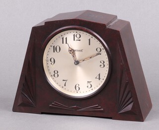 Ingersoll, a 1930's Art Deco alarm clock with silvered dial, Arabic numerals, contained in a brown Bakelite case 15cm x 19cm x 7cm 