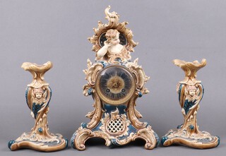 A 19th Century Continental 3 piece clock garniture comprising striking mantel clock contained in a porcelain Rococo style case surmounted by a figure of a child's head, the back plate marked Lenzkich and numbered 77407 35cm and a pair of candlesticks 