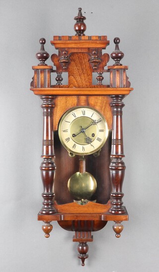 A 19th Century Continental regulator style striking wall clock with 14cm paper dial, Roman numerals, contained in a walnut case, complete with pendulum and key 