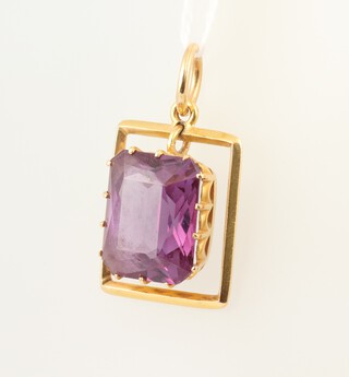 A yellow gold rectangular pendant marked 22k, hung a rectangular amethyst 7.23 grams  