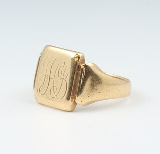 An 18ct yellow gold gentleman's engraved signet ring, size P 1/2, (misshapen) 8.6 grams  