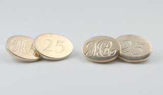 A pair of oval silver cufflinks London 1998, 19.6 grams, engraved MR and 25