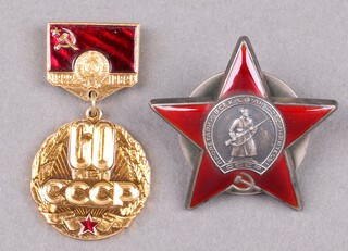 A Soviet Russian badge and a Soviet 60th CCP plastic badge 