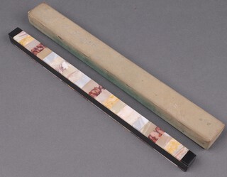 A Sobemap rectangular coloured marble map weight 2cm x 32cm x 2cm 