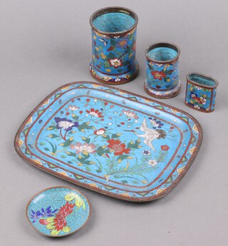 A 19th Century Japanese blue ground cloisonne enamelled tray decorated a stork and flowers 24cm h (3 star cracks to the back), 2 vases with floral decoration 9cm h (1 damaged) an oval vase 5cm and a circular bowl 7cm (damage to edge) 