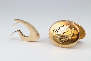 A gilt metal monogrammed photograph locket together with a gilt metal earring 