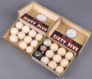 A collection of vintage golf balls including a Pin-Hi, Dunlop 651 and Slazenger 2 - all wrapped, together with 2 A E Penfold, 2 Spalding Top Flight, 8 Spalding Pro Flite, 7 Dunlop 65 and 1 other - all unwrapped, contained in 2 Dunlop 65 cardboard boxes