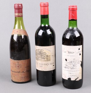 A bottle of 1968 Chateau Magdelaine Saint-Emilion Grand Cru (low on neck), a bottle of 1971 Chateau Le Vieux Saint-Emilion (low on neck) and a bottle of 1971 Chateauneuf-du-Pape (very low on neck) 
