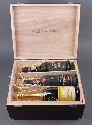A bottle of 1974 Taylors late bottled vintage port, a bottle of Dow's 1982 late bottled vintage port, a bottle of Paul Chamblain OO7 FM and HR Pinewood Studios sparkling wine marked "With thanks for joining in 2000" all contained in a Waitrose wine box 
