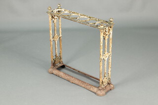 A Victorian white painted rectangular cast iron 6 aperture stick/umbrella stand 66cm h x 96cm w x 16cm d 