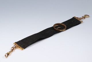 A silk watch hang with 9ct gold mounts 6.4g inc ribbon