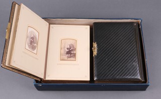 A Victorian double sided photograph album with leather binding of cushion form with gilt metal mounts containing 47 various studio photographs complete with original outer case 6cm x 37cm x 25cm 