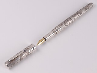 A silver fountain pen made for The Worshipful Company of Goldsmiths to commemorate the Millennium London 2000 with Millennium hallmark, the nib marked 18k-750, gross weight 62 grams