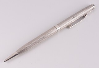 A silver propelling pencil with engine turned decoration Birmingham 1985 by S J Ross & Sons, gross weight 50 grams