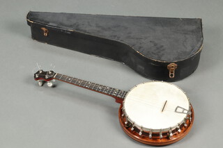 A Sully four stringed tenor? banjo with turned and inlaid wooden frame, complete with carrying case  