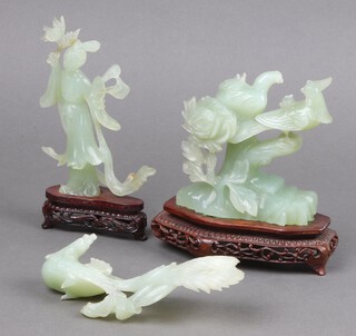 A green soapstone figure of a standing lady 18cm and a ditto figure of 2 birds 12cm 
