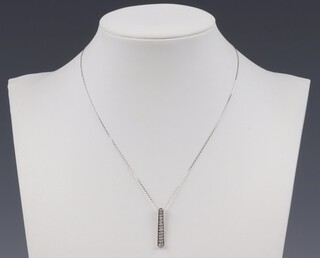 A 9ct white gold pendant hung on a 9ct gold chain 1.4 grams 