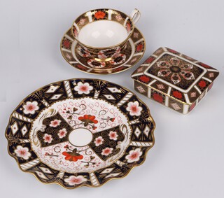 A rectangular Royal Crown Derby  porcelain trinket box 1128 XLIX 411 10, a circular ditto plate 2451 LXVIII 22cm, a cup and saucer 1128 XXXVII (second) 
