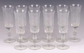 A set of 10 etched glass champagne flutes 