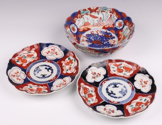 A 19th Century Japanese Imari porcelain bowl with panelled decoration 22cm, 2 Japanese Imari porcelain plates with segmented decoration 23cm (chipped)