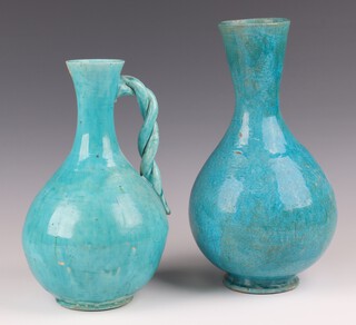 A Isnic style turquoise pottery club shaped jug 27cm (chip to rim) and a club shaped vase 31cm  