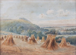 H.C. Howard, Landscape with Hay Stooks, early 20th century watercolour, signed, 25cm x 36cm, within a gilt frame.