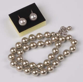 A rope of Sashima simulated lacquered pearls together with a pair of matching earrings  
