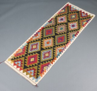 A white, black and green ground Maimana Kilim runner with all over diamond design 200cm x 71cm 
