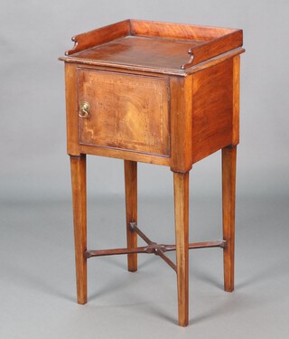 A 19th Century inlaid mahogany pot cupboard with three-quarter gallery enclosed by a panelled door, on square supports with X framed stretcher 84cm h x 43cm w x 37cm d 