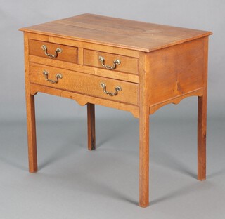 An 18th Century oak side table fitted 2 short and 1 long drawers, raised on square tapered supports 70cm h x 76cm w x 45cm d 
